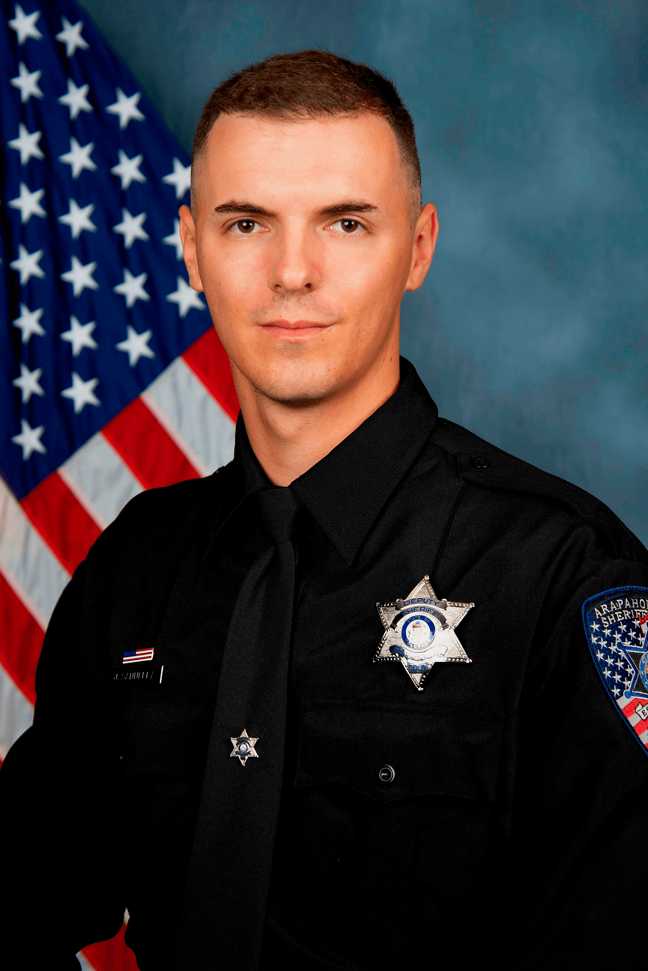 Jordi Enric Sannella in law enforcement uniform